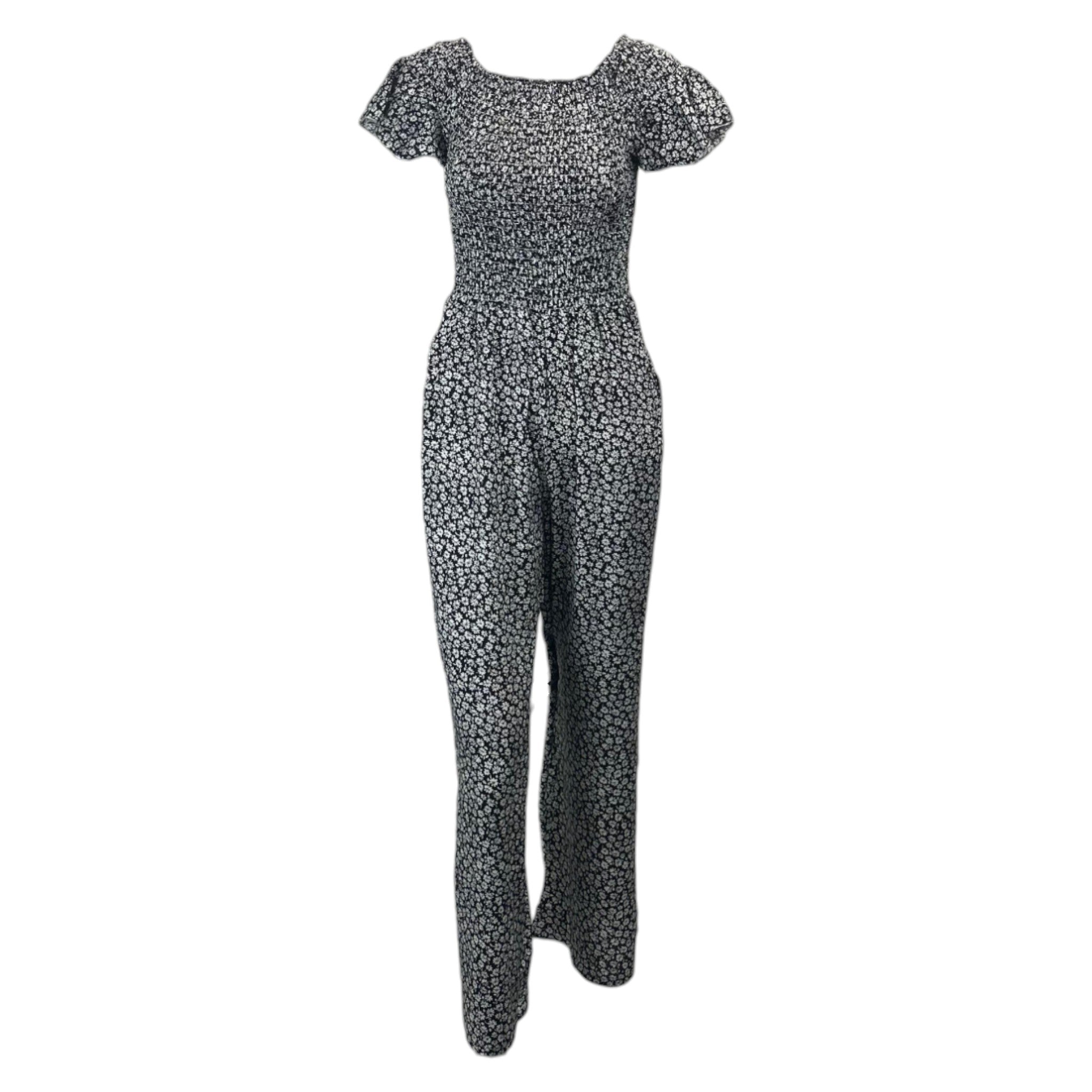 Black floral women's jumpsuit with short sleeves and cropped legs โ lightweight summer outfit